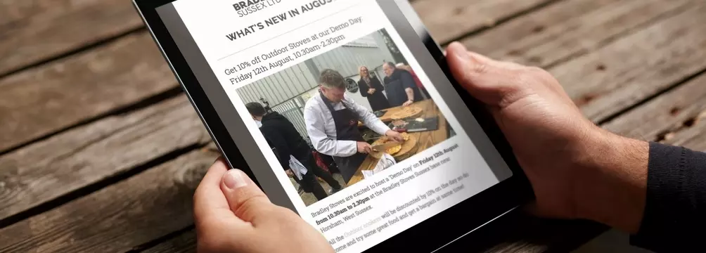 Article on Tablet PC held by man